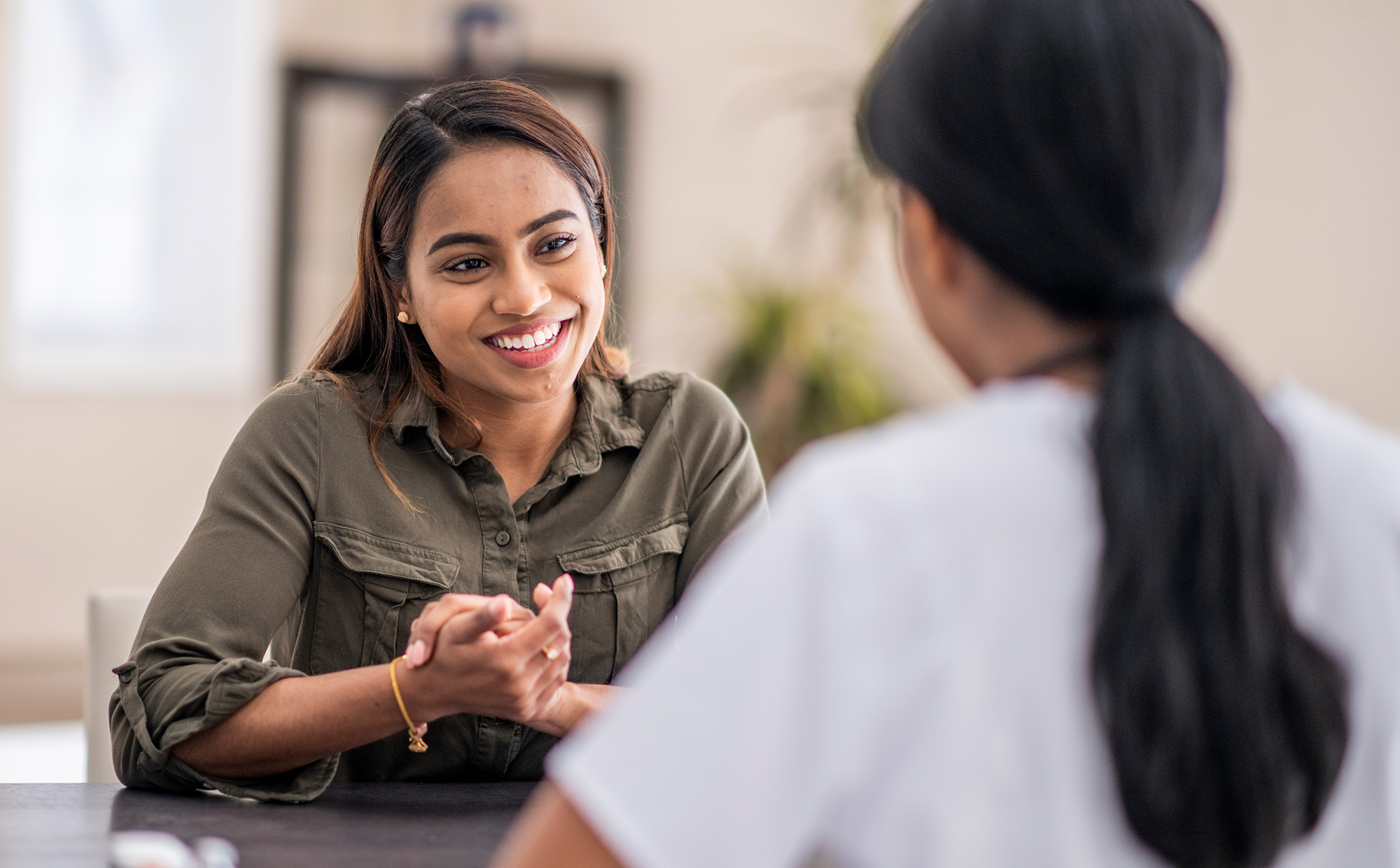 Woman talking to a female health professional